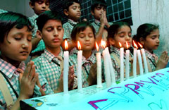 Students of a private school in Bathinda praying on Monday for the peace in the country after recent blasts that claimed several lives in Bangalore and Ahmedabad.