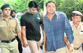 Policemen take Amandeep Singh and Jaswinder Singh Rocky, prime accused in the Dimpy murder case, to the District Courts in Chandigarh