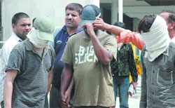 Three persons, including one Nigerian, who are allegedly involved in a drug racket, are produced in court by the crime branch of the Delhi police on Monday. Tribune photo