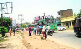GRAVE RISK: An overloaded private bus plies in Kaithal.
