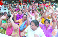 Activists of the PKMU raise slogans against the government in Jalandhar on Monday.