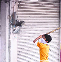 A boy targets a power meter in Jammu on Monday. 