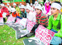 Members of the Association of Parents of Disappeared Persons hold a protest in Srinagar on Monday. 