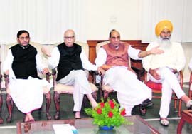 L.K. Advani with BJP president Rajnath Singh and other NDA leaders at a meeting at Advanis residence in New Delhi on Monday.