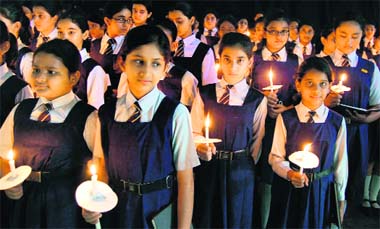 Students pay tributes to victims of the Ahmedabad and Bangalore terror attacks, in Lucknow on Monday. 