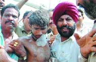 A labourer being rescued.