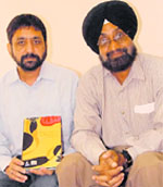 Ishwar Dayal Gaur and Surinder Singh with their edited book Popular Literature and Pre-Modern Societies in South Asia at Panjab University, Sector 14, Chandigarh.