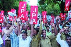 JPA Union activists demand pension at a protest rally against the UPA government in New Delhi on Tuesday. 