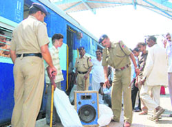 Jawans of the RPF check the luggage of passengers at Sirsa railway station