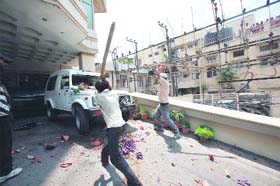 A vehicle bears the brunt of the onslaught