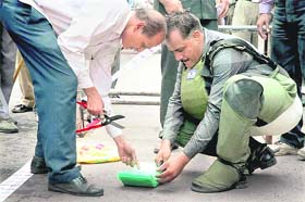 A bomb disposal squad defuses a bomb in Surat