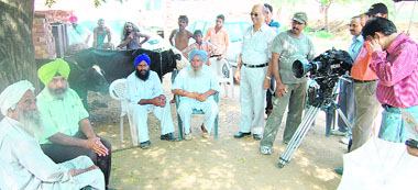 A team of Films Division, Government of India, during the shooting of a documentary on Mohammad Rafi at his native village Kotla Sultan Singh in Amritsar on Tuesday.