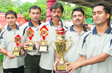 Winners pose with their trophies at Table Tennis Hall, Sector 23, Chandigarh, on Wednesday.