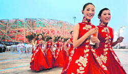 Chinese performers leave the National Stadium which is also known as the "Bird's Nest" for a rehearsal of the Olympic opening ceremony in Beijing