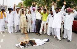 Panches of villages Bangi Ruldu raise slogans after burning effigy of an SGPC member in Bathinda