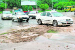 (From Left) The year-old-road has caved in opposite the Punjab School Education Board; the two-month-old cave-in on the Sector 49-Phase 10 dividing road; and a cave-in filled with loose earth at the YPS roundabout. 