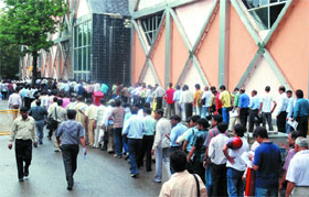 People queue up to file income tax returns on the last day at Pragati Maidan in New Delhi on Thursday.
