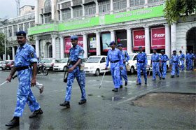 Jawans of the Rapid Action Force patrol at Connaught Place in New Delhi on Thursday after the Japanese Embassy received a threatening email.