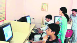 Members browse the Internet at the e-library in Sirsa.