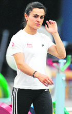 Turkish Olympic weightlifting champion Nurcan Taylan practices at the Beijing Aeronautics University Gymnasium on Thursday.