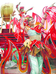 Performers take part in a procession outside the National Stadium, also known as the Birds Nest, in Beijing on Thursday ahead of the 2008 Olympic Games.