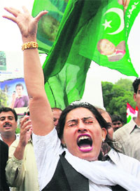 A lawyer chants anti-government slogans during a protest rally in Lahore on Thursday. Lawyers gathered to demand resignation of Pakistan President Pervez Musharraf and reinstatement of the 60 sacked judges.