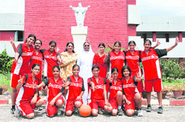 The jubilant basketball team of Sacred Heart School, Sector 26, Chandigarh, with Sister Sebastina after winning the inter-school basketball meet.