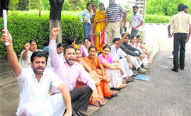 Agitating students of Punjabi department raise slogans outside VC office at Panjab University.