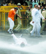 Police uses water cannons to disperse activists of the Amarnath Yatra Sangharsh Samiti at Jantar Mantar in New Delhi