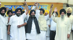Patron of the Shiromani Akali Dal and Punjab Chief Minister Parkash Singh Badal with president of SAD Sukhbir Singh Badal and Delhi party leader Manjit Singh GK at a conference in New Delhi.