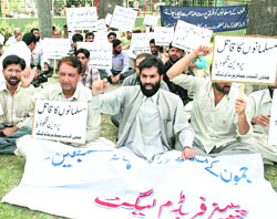 Activists of the Jammu and Kashmir Peoples Freedom League protest the alleged attack on Kashmiri drivers and vehicles in Srinagar on Saturday. 