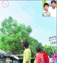 The live wire that took two lives in Mohali on Sunday; and (inset) the victims Sita Ram and Rajesh. 