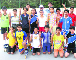 Winners of Inter-School District Skating Tournament, held at Manav Mangal School, Sector 11, flash victory sign. 