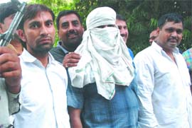 The three accused in the Kalkaji Mittal murder case being presented before the media in New Delhi on Sunday. 