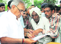 Chief Minister Bhupinder Singh Hooda listens to peoples grievances in Rohtak