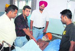 Doctors examine Banarsi Singh at Hind Hospital, Ahmedgarh