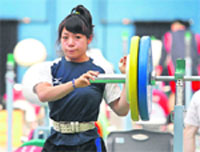 Japan's Hiromi Miyake takes part in a weightlifting training session ahead of the Beijing 2008 Olympic Games