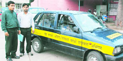 Nazim Ahmed (left) with his modified Maruti car in Chandigarh on Monday. 