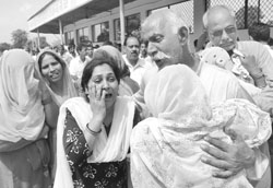 Grieving family members of seven Naina Devi stampede at Rajpura