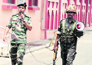 Army personnel ask people to stay indoors in the strife-torn Jammu.