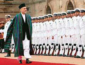 Afghanistan president Hamid Karzai inspects a guard of honour during a ceremonial reception at Rashtrapati Bhawan in New Delhi on Monday.