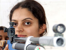Shooter Avneet Sidhu aims during a practice session.