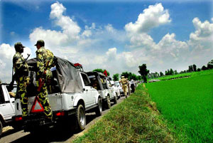 The motorcade of SAD president Sukhbir Singh Badal passes through Phul village in Bathinda district on Tuesday. 