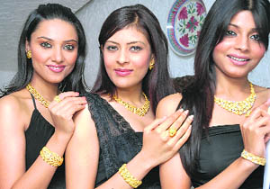 Models display 24-karat gold jewellery by Thailand-based Pranda Jewellery Pvt Ltd at its launch in New Delhi on Tuesday.