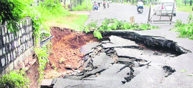 The road connecting Punjab and Haryana CMs residences with the civil secretariat that caved in following heavy rain in Chandigarh on Monday.