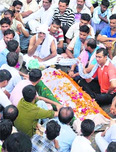 People throng the funeral of Sanjeev Singh killed in police firing at Samba