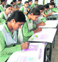 Students participate in a poster-making competition held in connection with the breastfeeding week organised by the Indian Academy of Paediatries in Ludhiana. 