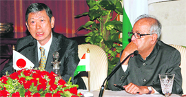 Japan's foreign minister Masahiko Koumura (left) speaks as his Indian counterpart Pranab Mukherjee watches during a news conference in New Delhi on Tuesday.