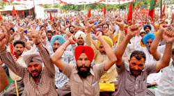 Activists of Technical Services Union hold protest outside the thermal plant in Bathinda