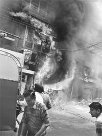 Fire fighters try to control the fire that broke out at the market in Ambala Cantt on Wednesday.